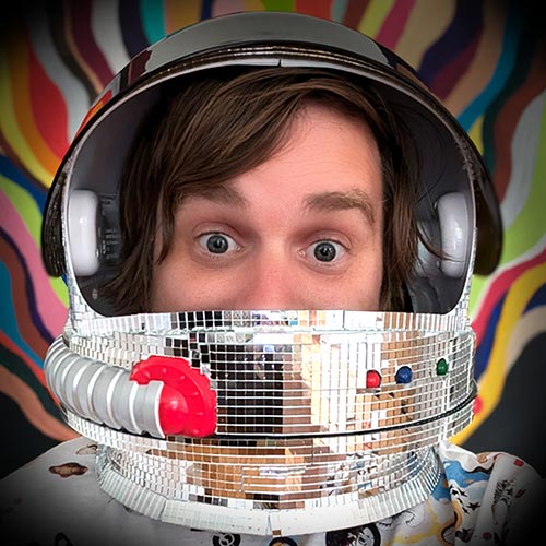 Brad Frost wearing a disco-ball space helmet